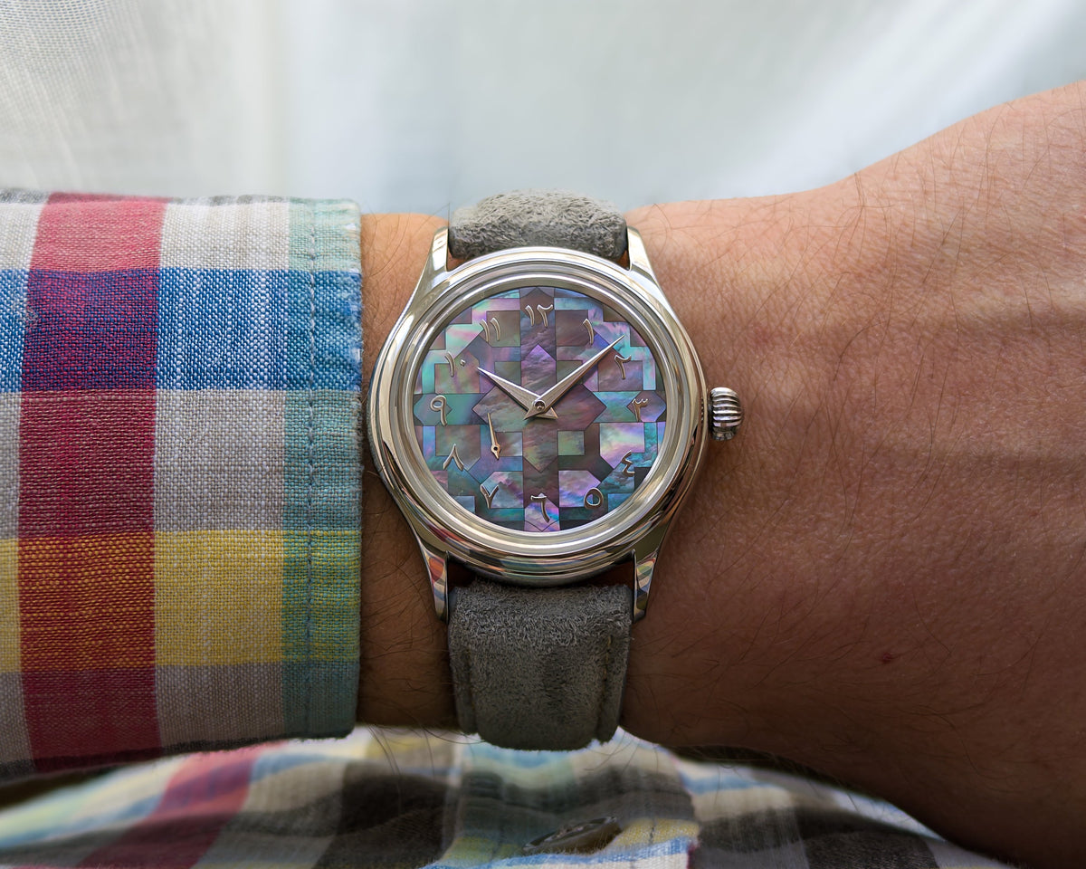 Close view of the L’Artisan Arabic Mosaic mother-of-pearl dial